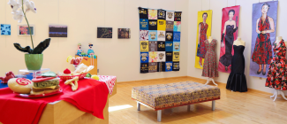 inside of the art gallery space with display of artwork hanging on the walls