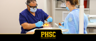 PHSC male dental student cleaning a male patient's teeth.